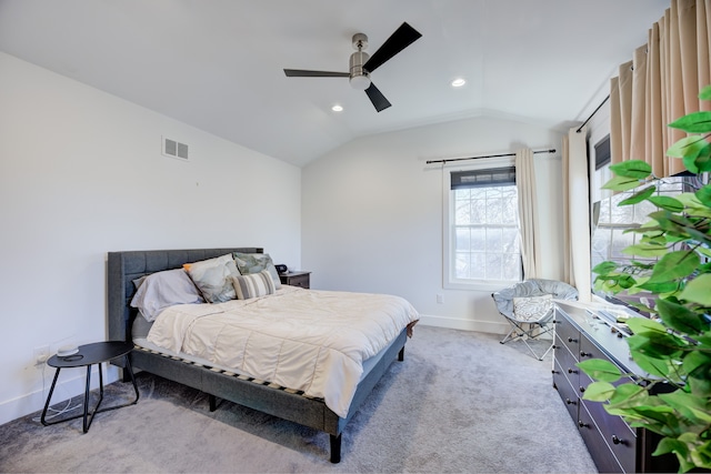 bedroom featuring ceiling fan, light colored carpet, and lofted ceiling