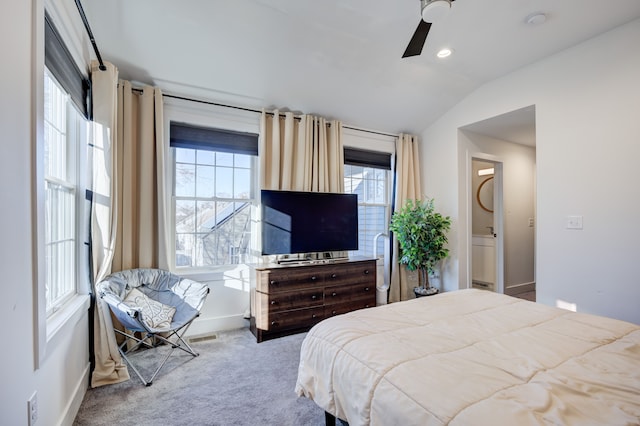 carpeted bedroom featuring ceiling fan, lofted ceiling, and multiple windows