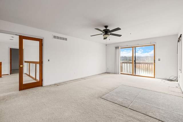 carpeted empty room with ceiling fan