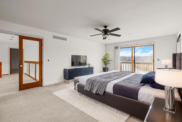 bedroom with access to exterior, light carpet, and ceiling fan