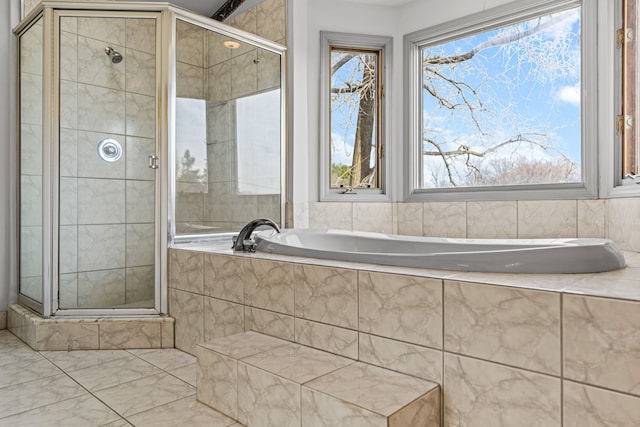 bathroom with shower with separate bathtub