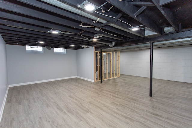 basement featuring hardwood / wood-style floors