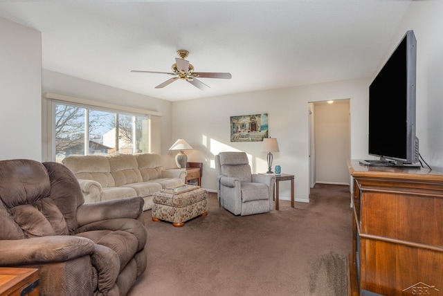 carpeted living room with ceiling fan