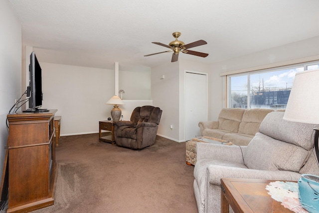 carpeted living room featuring ceiling fan