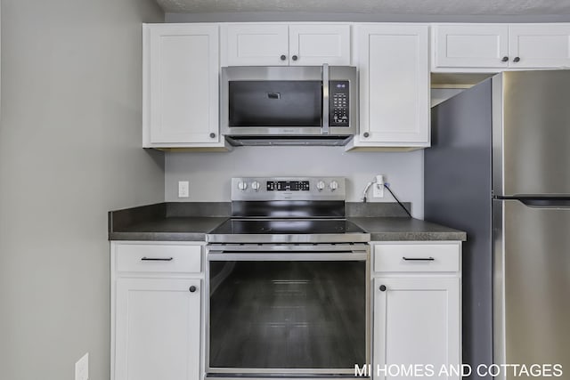 kitchen featuring white cabinets and stainless steel appliances