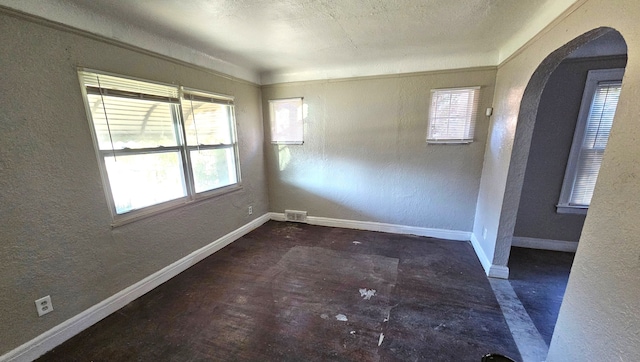 empty room featuring plenty of natural light