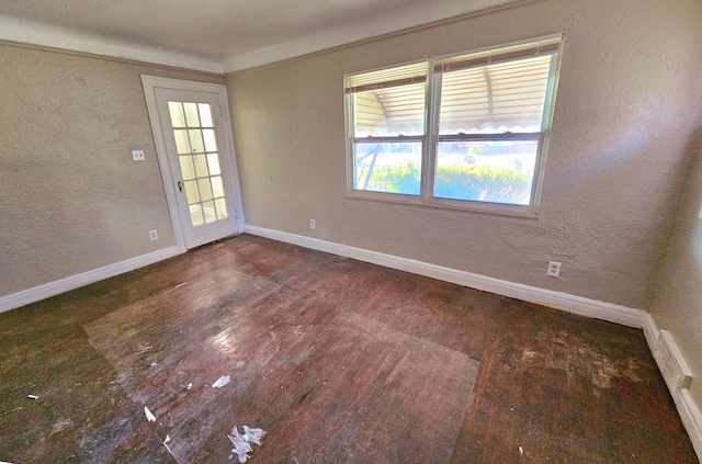 unfurnished room with ornamental molding