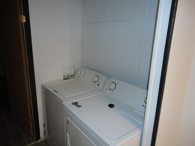 clothes washing area with washer and dryer