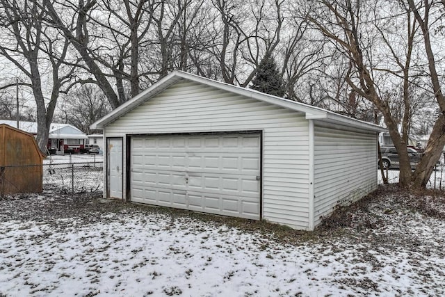 view of snow covered garage