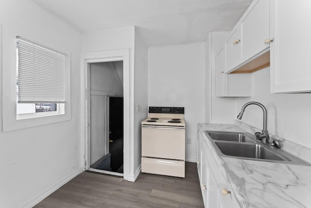 kitchen featuring white range with electric cooktop, dark hardwood / wood-style floors, white cabinetry, and sink