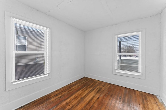 empty room featuring dark wood-type flooring