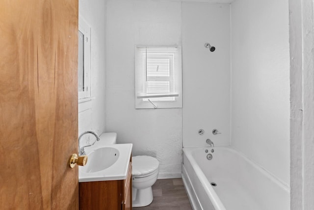 full bathroom featuring shower / bathing tub combination, vanity, wood-type flooring, and toilet