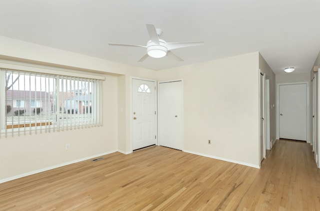 foyer entrance featuring ceiling fan and light hardwood / wood-style floors