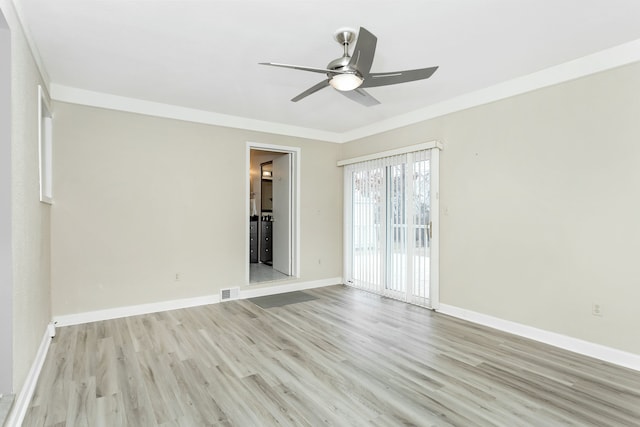 spare room with ceiling fan and light wood-type flooring