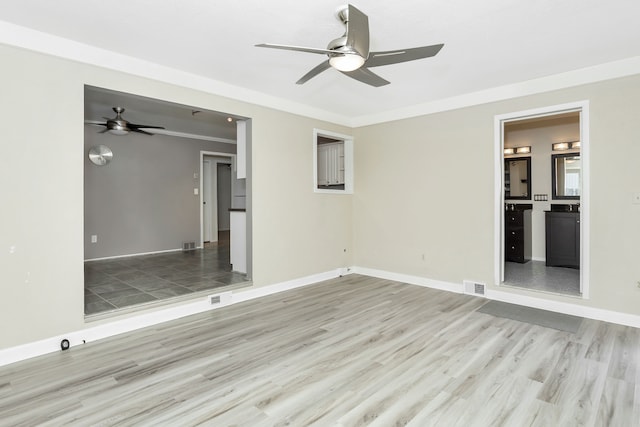 unfurnished bedroom with crown molding, connected bathroom, ceiling fan, and light hardwood / wood-style floors