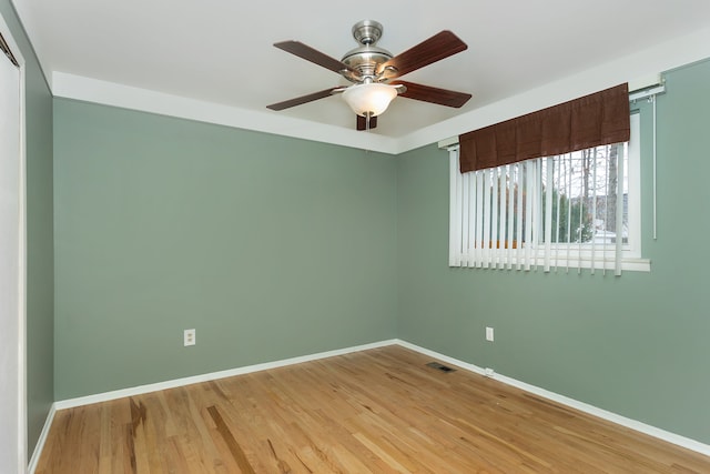 spare room featuring ceiling fan and light hardwood / wood-style floors