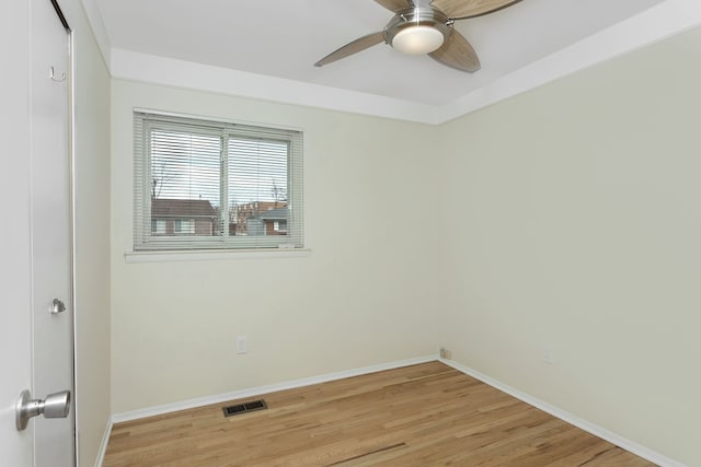 spare room with light hardwood / wood-style flooring and ceiling fan