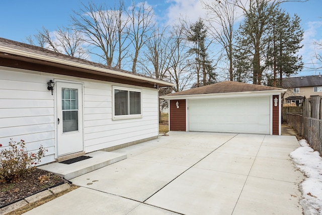 exterior space featuring a garage and an outdoor structure