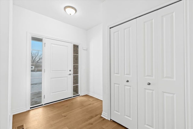 foyer with light wood-type flooring