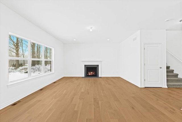 unfurnished living room with light hardwood / wood-style floors