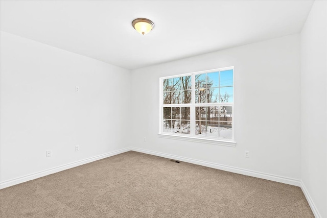 empty room featuring carpet floors