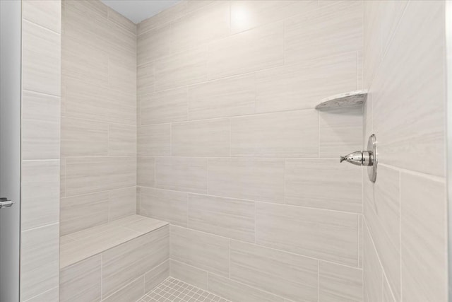 bathroom featuring tiled shower