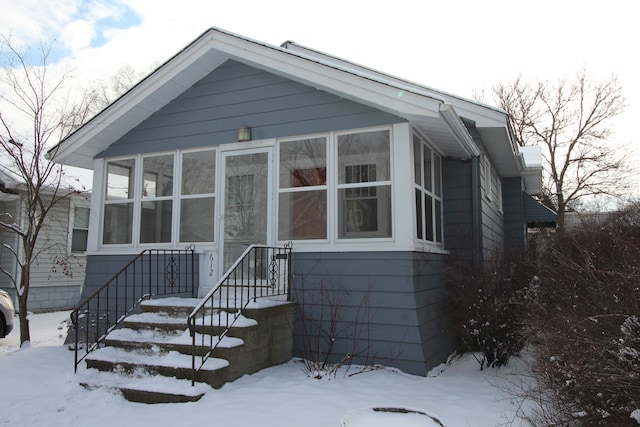 view of front of house with a sunroom