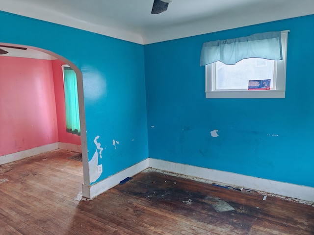 spare room featuring wood-type flooring