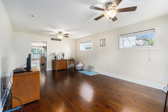 500 Myrtle Ave, Sturgis, MI 49091 - living room with ceiling fan, dark wood finished floors, healthy amount of natural light, and baseboards