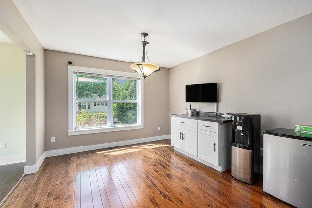 500 Myrtle Ave, Sturgis, MI 49091 - unfurnished living room with baseboards and hardwood / wood-style floors