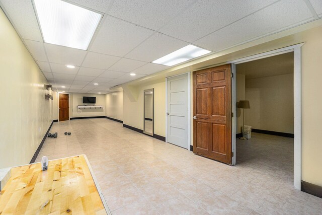 500 Myrtle Ave, Sturgis, MI 49091 - empty room featuring baseboards, recessed lighting, a paneled ceiling, and light tile patterned floors