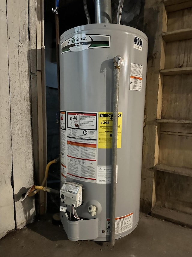 utility room featuring gas water heater