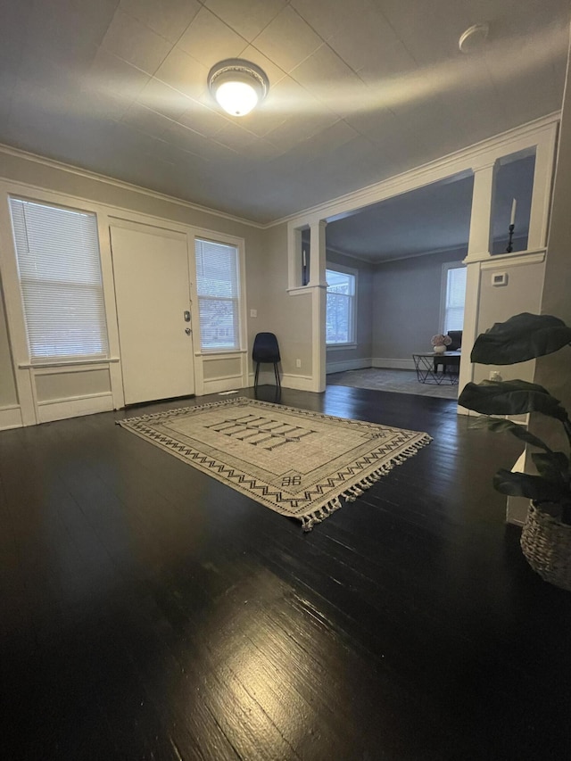 interior space featuring hardwood / wood-style flooring and ornamental molding