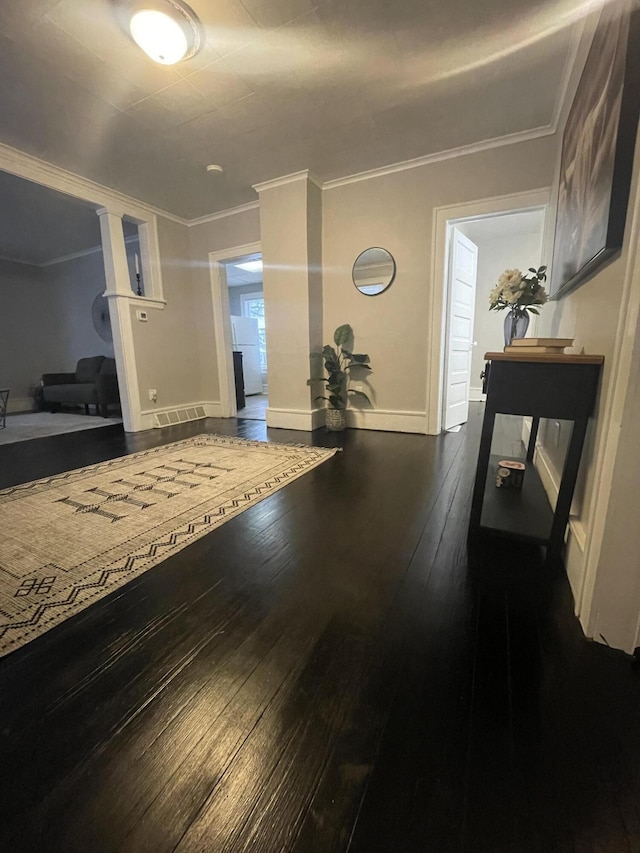 hallway featuring dark hardwood / wood-style flooring and crown molding