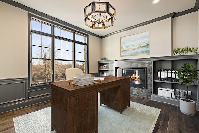 office with ornamental molding, dark wood-type flooring, and a notable chandelier