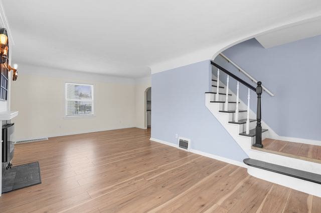 unfurnished living room featuring light hardwood / wood-style floors