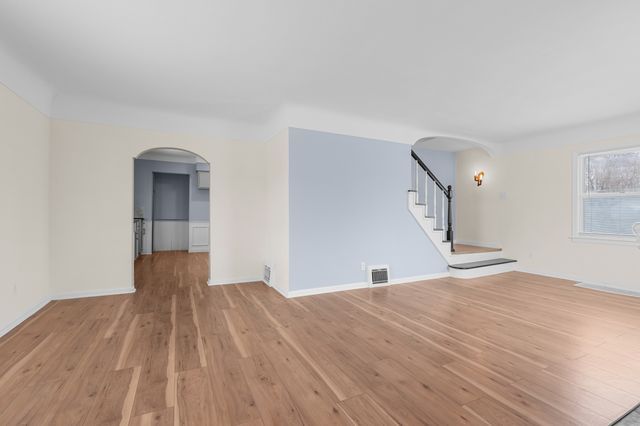 unfurnished room with light hardwood / wood-style floors