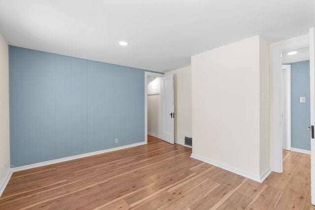 spare room featuring light wood-type flooring