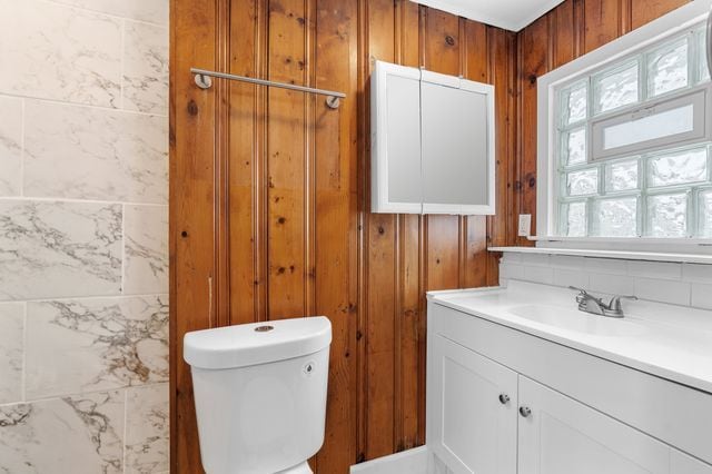 bathroom featuring vanity and toilet