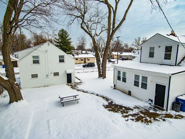 view of snow covered house