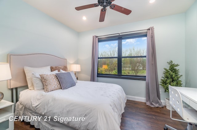 bedroom featuring dark hardwood / wood-style flooring and ceiling fan