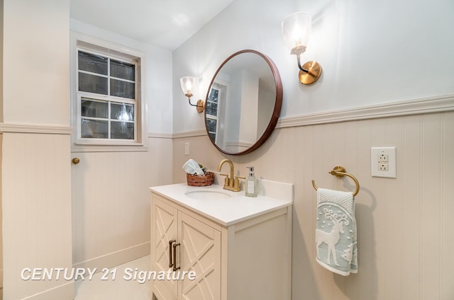 bathroom featuring vanity and wooden walls