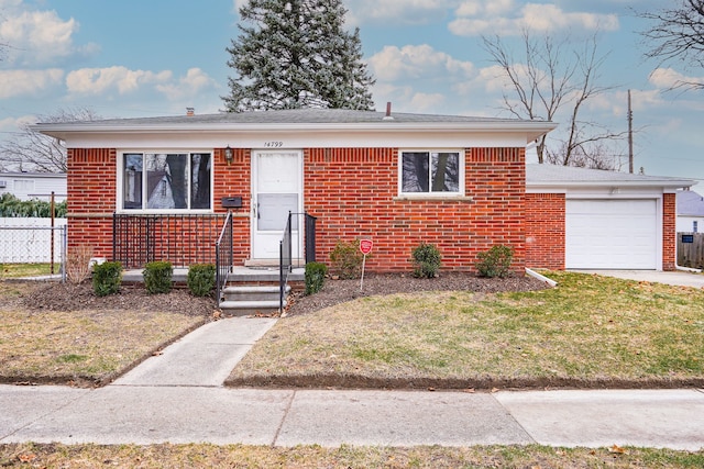 bungalow-style house featuring a front yard and a garage