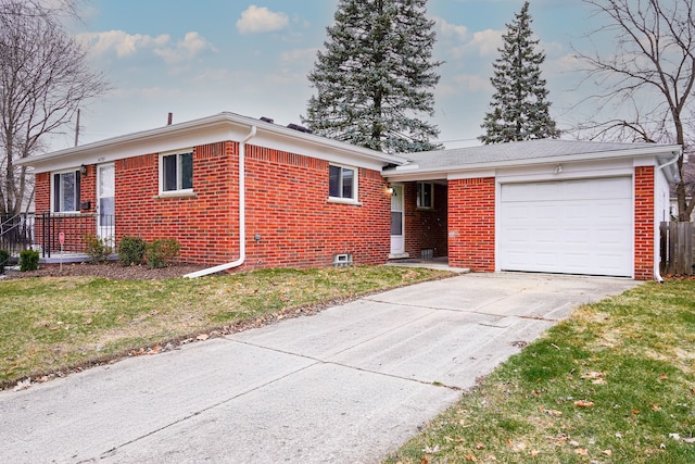 ranch-style house featuring a garage and a front lawn