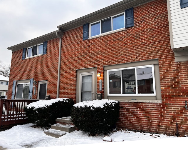 exterior space with brick siding