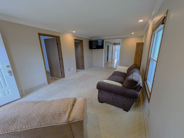 carpeted living room with crown molding