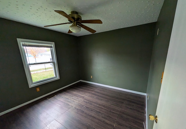 unfurnished room featuring dark hardwood / wood-style floors and ceiling fan