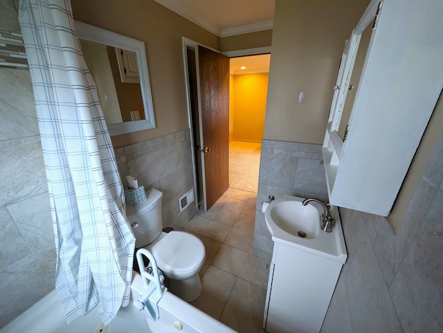 full bathroom featuring shower / bath combination with curtain, tile patterned floors, vanity, tile walls, and toilet