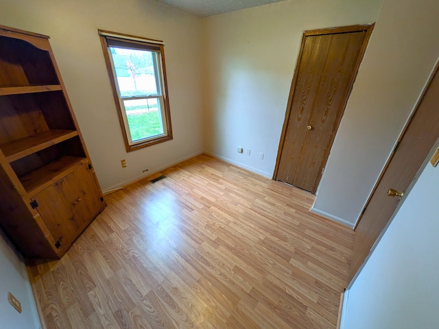 bedroom featuring light wood-type flooring