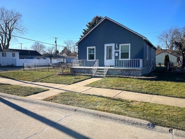 bungalow-style house with a porch and a front lawn